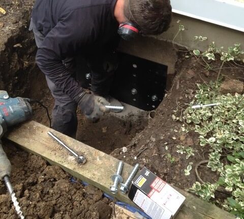 Retainer being bolted in place